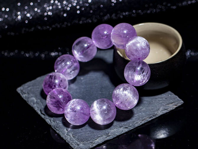 Natural old-mined kunzite bracelet, with a clear body and cat's eye effect.